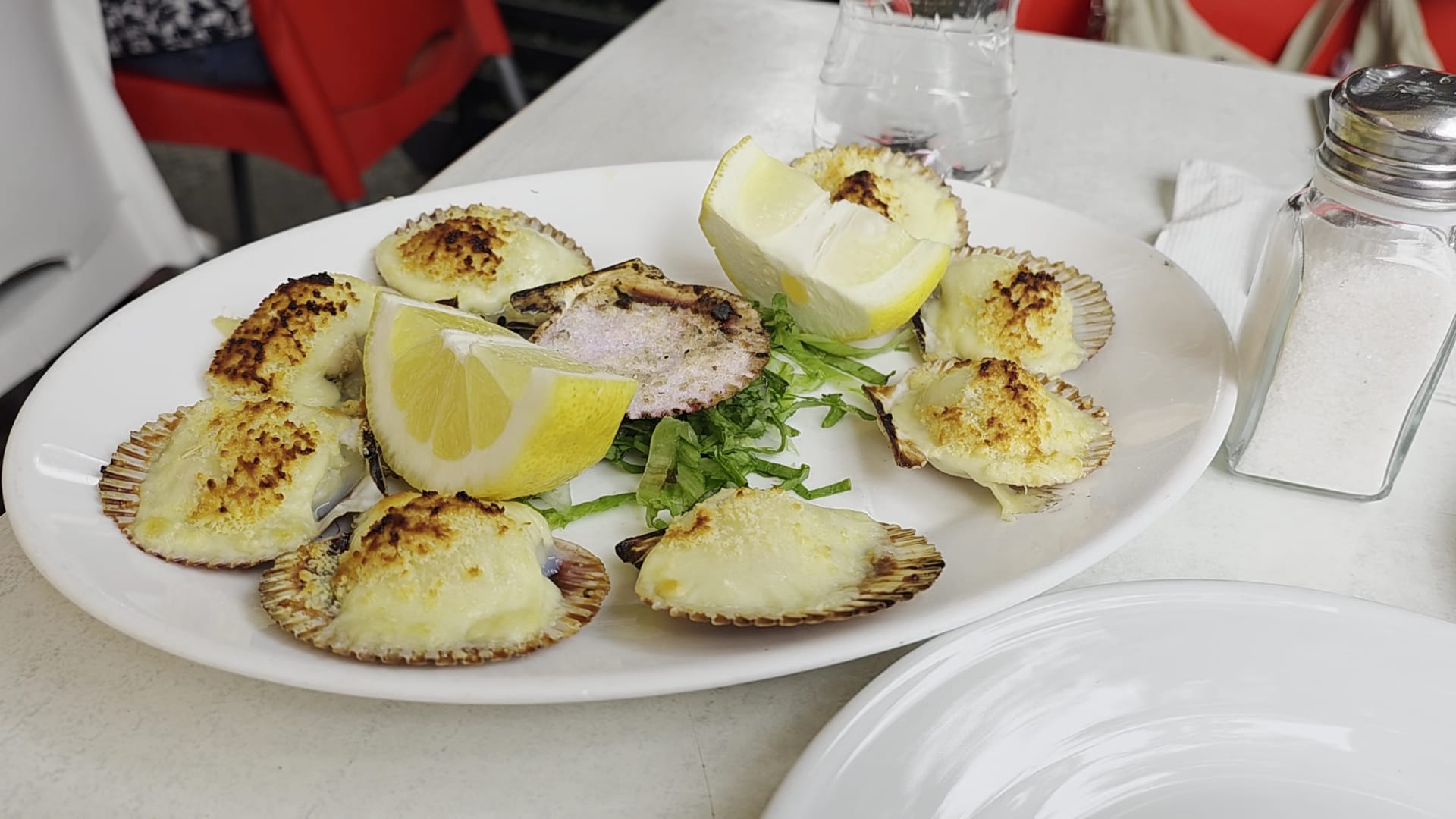 Machas a la parmesana no restaurante Galindo em Santiago